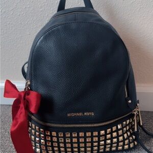 Michael Kors Black Backpack with Gold Studs and Red Bow